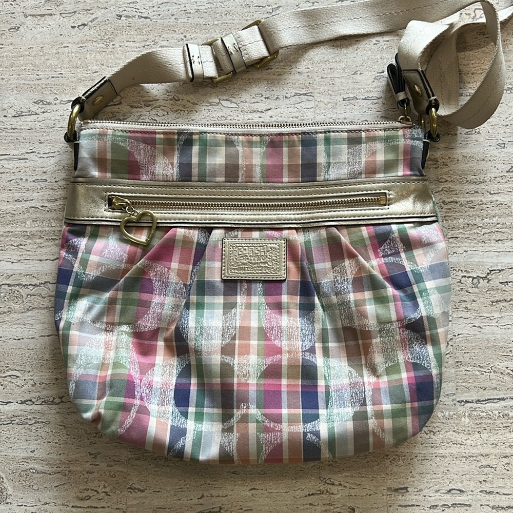 Pre-owned COACH multi-color crossbody bag.